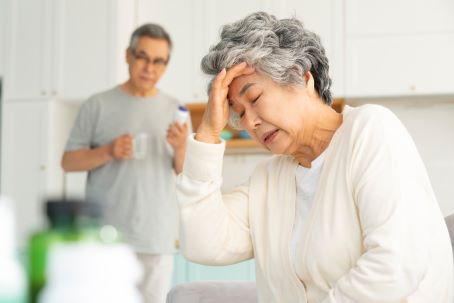 elderly woman with head pain