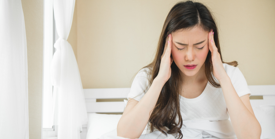 woman with migraine symptoms