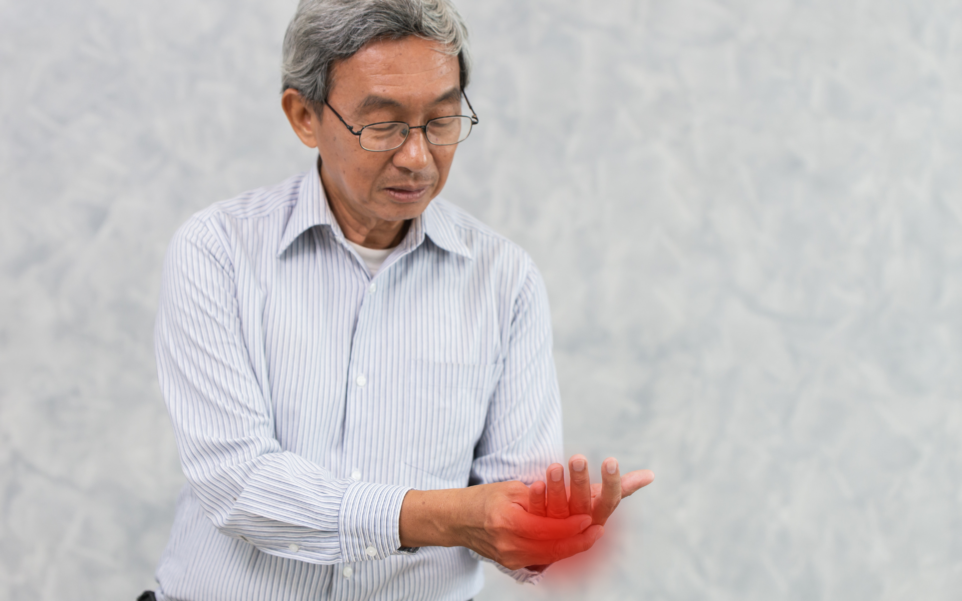 men holding his hand in pain